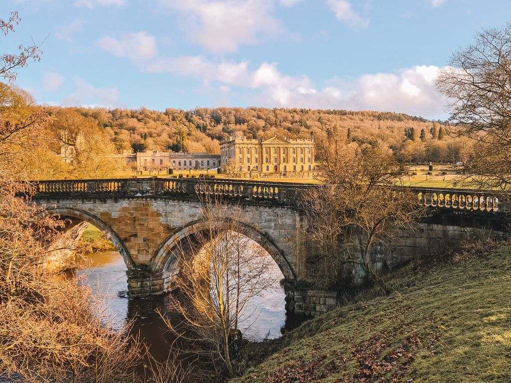 bridge overlooking chatsworth house in the background