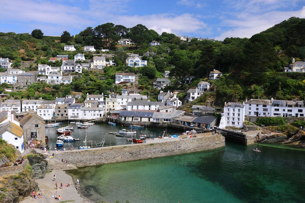 View looking down onto a harbour with many boats and buildings lining the water